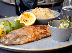 Fried fish with potatoes and sauerkraut