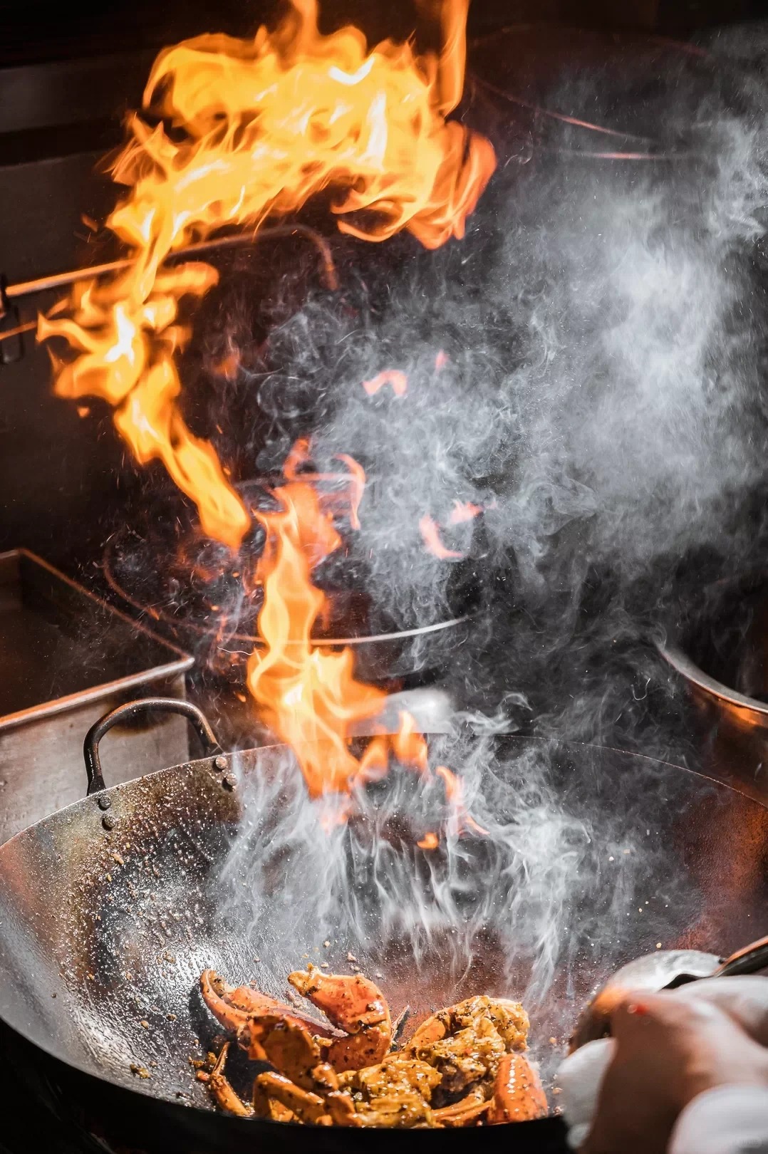 Flipping the wok to stir fry
